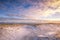 Snowy path leading to the beach under golden light. Fire Island New york