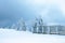 Snowy pathway with wooden fence