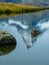 The snowy peak of the Matterhorn in Switzerland is reflected in the surface of a mountain lake