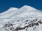 Snowy peaks of mount Elbrus on a bright cloudless day