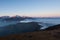 Snowy peaks panorama with amazing clouds floating.