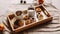 Snowy Pine Tree Cones, Cups, Cakes and Dry Citrus on Wooden Tray. Christmas Decoration, Aromatic Cinnamon, Empty Mugs and Sweet