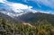 Snowy Pine Tree Forest with a Background of Snow-Capped Mountains in Huanglong, China