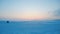 Snowy plain at sunset, arctic landscape