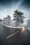 Snowy road with dramatic sky