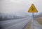 Snowy road with frozen sign