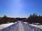 The snowy road in the Russian village