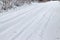 Snowy road after snowfall. Winter rural landscape