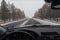 Snowy roadway through window