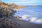 Snowy and rocky overlook of the ocean and coast during winter