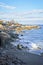 Snowy and rocky overlook of the ocean and coast during winter