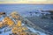 Snowy and rocky overlook of the ocean and coast during winter