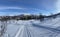 Snowy scenes in Hovden, Norway. Snow covered houses and Ski tracks on the ground, Blue skies. Bluebird weather.