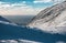 Snowy slope mountain on arctic coastline