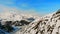 Snowy slopes of high mountains in the wilderness