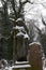 The snowy Statue from the mystery old Prague Cemetery, Czech Republic