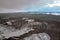 Snowy stony hill. Mountain top in winter