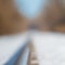 Snowy straight railroad track - low depth of field and pretty blurred bokeh -  near the Minnesota River and near Black Dog coal po