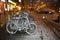 Snowy street in Berlin at night with several bikes