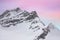 Snowy summits of mount Jungfrau in the Bernese Alps against the backdrop of sunset sky in the pastel color, Switzerland