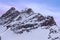 Snowy summits of mount Jungfrau in the Bernese Alps against the backdrop of sunset sky in the pastel color, Switzerland