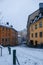 Snowy, traditional Swedish street at Christmas in the evening light, Sodermalm, Stockholm, Sweden.