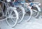 Snowy wheels of bicycles