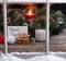 Snowy window view of cookies and milk plus card for Santa Claus