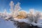 Snowy winter ravine with bushes on the Creek Bank, Russia, the Urals,