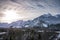 Snowy wooded hahnenkamm mountain range in tyrol reutte with colorful and exciting clouds