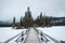 Snowy wooden bridge and tiny pine forest at Pyramid Lake on winter in Jasper national park