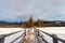 Snowy wooden bridge and tiny pine forest at Pyramid Lake on winter in Jasper national park