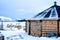 Snowy wooden cabin in the Sami camp in the Tromso fjord