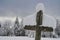 Snowy wooden cross