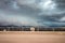 SNYDER, COLORADO - MAY 27, 2019: Cattle stand with their backs turned to a tornado-warned thunderstorm.