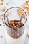 Soaked hazelnuts in blender. Making vegan nut milk