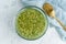 Soaking green peas cereal in water to ferment cereals and neutralize phytic acid. Large glass bowl with grains flooded with water