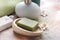 Soap and bathing accessories on table