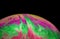Soap bubble on a dark background. Lots of colors and a magical texture