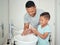 Soap, father and child cleaning hands for hygiene, wellness and positive morning routine in a healthy lifestyle. Happy