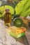 Soap, limes, aromatic oil on a wooden table