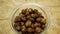 Soap nuts Indian soapberry or washnut glass jar cup, Sapindus mukorossi reetha or ritha from the soap tree shells are