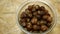Soap nuts Indian soapberry or washnut glass jar cup, Sapindus mukorossi reetha or ritha from the soap tree shells are