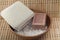 Soap, sea salt in a wooden bowl cleansers