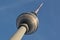 Soaring shaft and silver sphere of Fernsehturm TV tower in Berlin