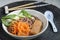 Soba noodle soup with fried tofu, carrot, and bok choy