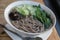 Soba noodles with soup on wooden tray