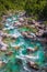 Soca Valley, Slovenia - Aerial view of the emerald alpine river Soca on a bright sunny summer day with green foliage