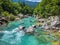 Soca Valley, Slovenia - Aerial view of the emerald alpine river Soca with rafting boats going down the river