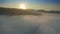 Soca Valley, Slovenia - Flying out of the clouds at sunrise over Julian Alps in the beautiful Soca Valley in Triglav National Park